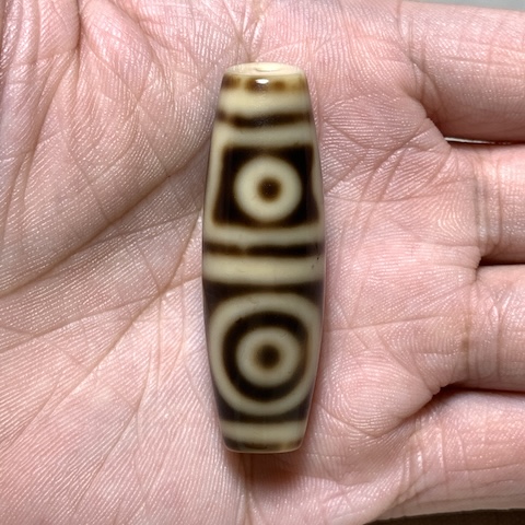 Sakor Namkor and Four Eyed Dzi Bead